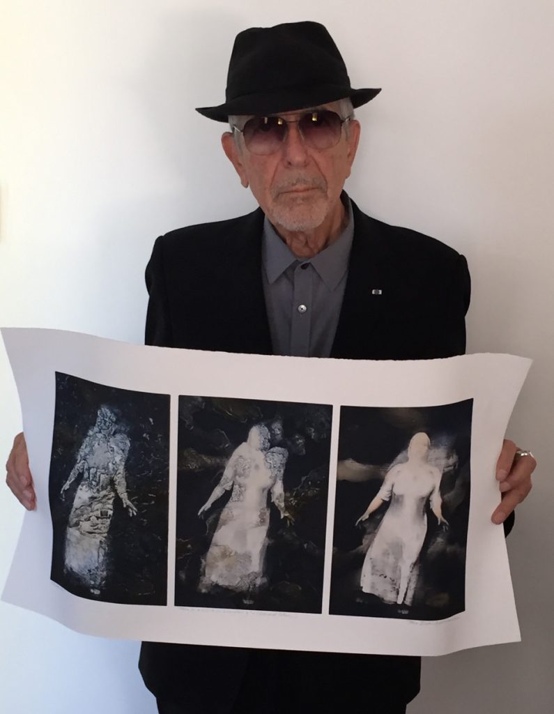 Leonard Cohen holding a print